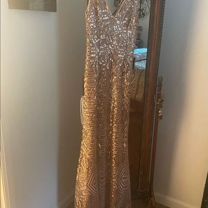 Good sequin formal long dress brand new tags still on.